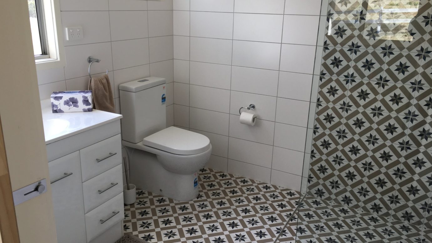 The large shower and fully tiled bathroom is comfortable and roomy.