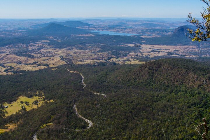 View of mountains, road, lake, farmland and forest.