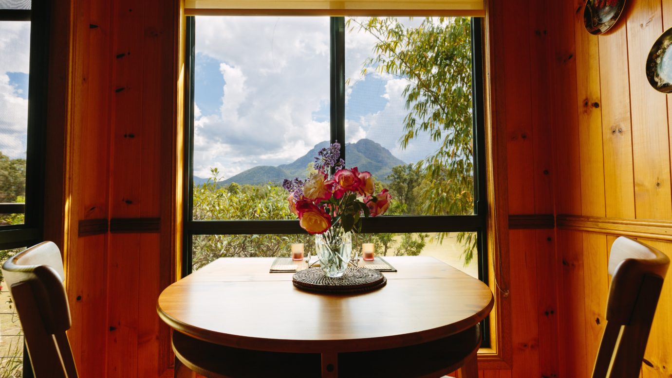 Take in the view of Mt Maroon whilst dining in the Blue Wren Cottage