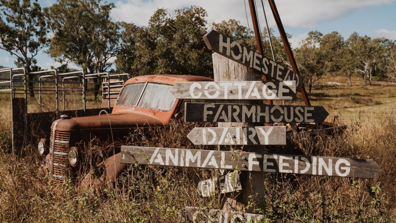 Old bedford truck and rustic farm sign. Country charm