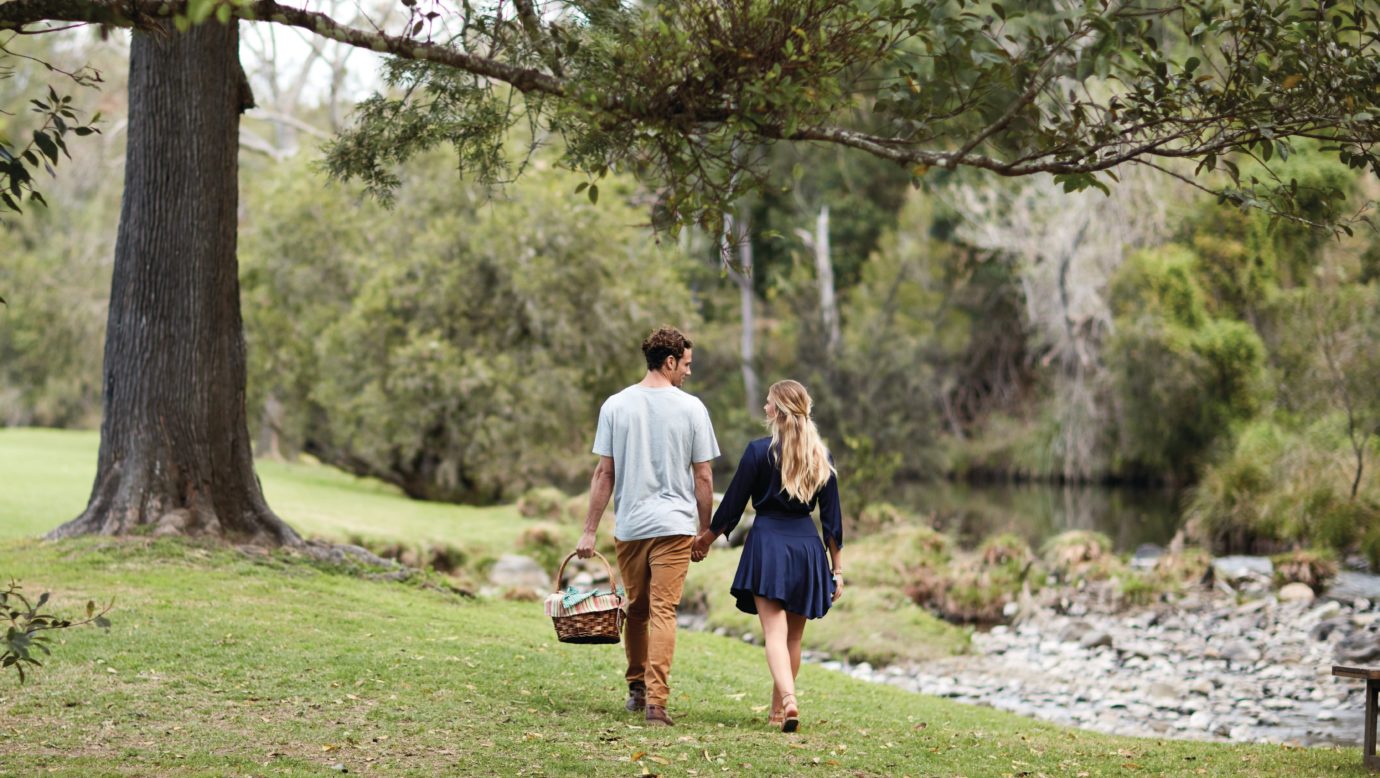 Couple walking through Canungra