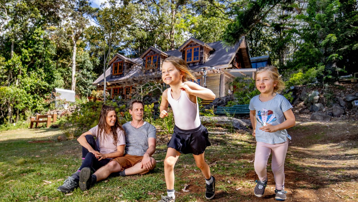 Family enjoying the front lawn of Groom's Cottage