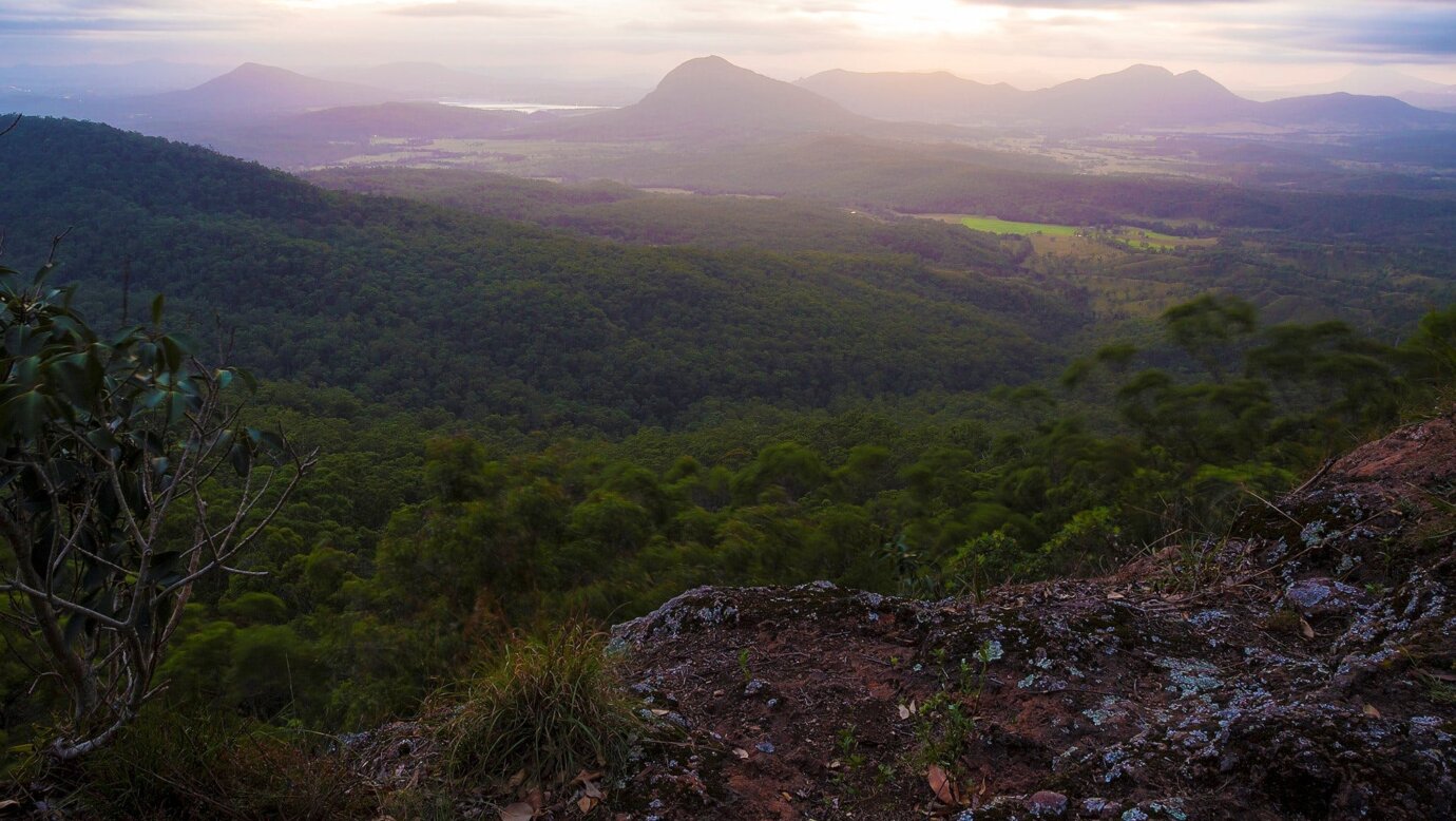 View over flats, mountains and valleys on cloudy day.