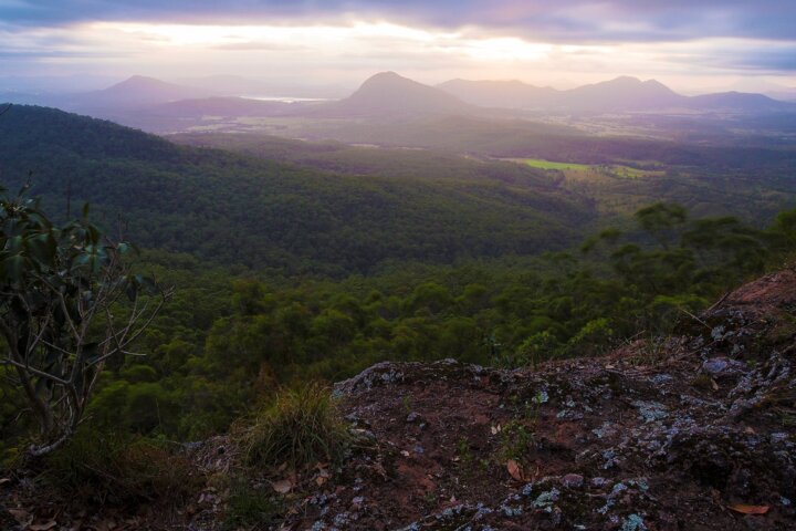 View over flats, mountains and valleys on cloudy day.