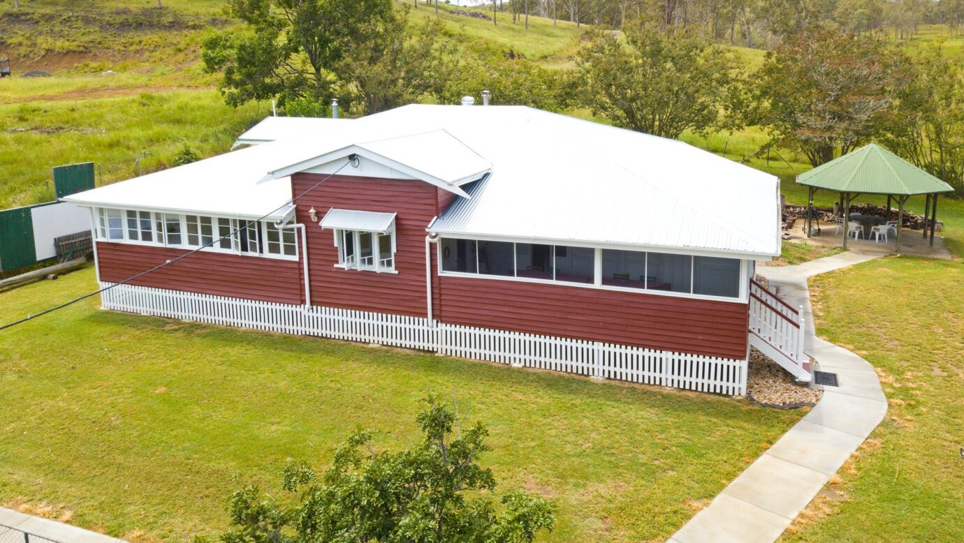 Drone view of Willmann House - a Queenslander farmhouse for group accommodation. Sleeps 9 adults.