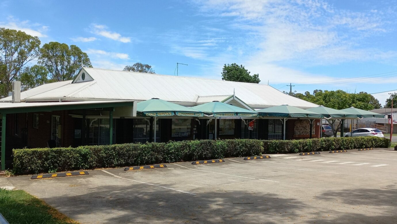 Our lovely building with the umbrellas over our Tea Garden for shade while enjoying a Devonshire Tea