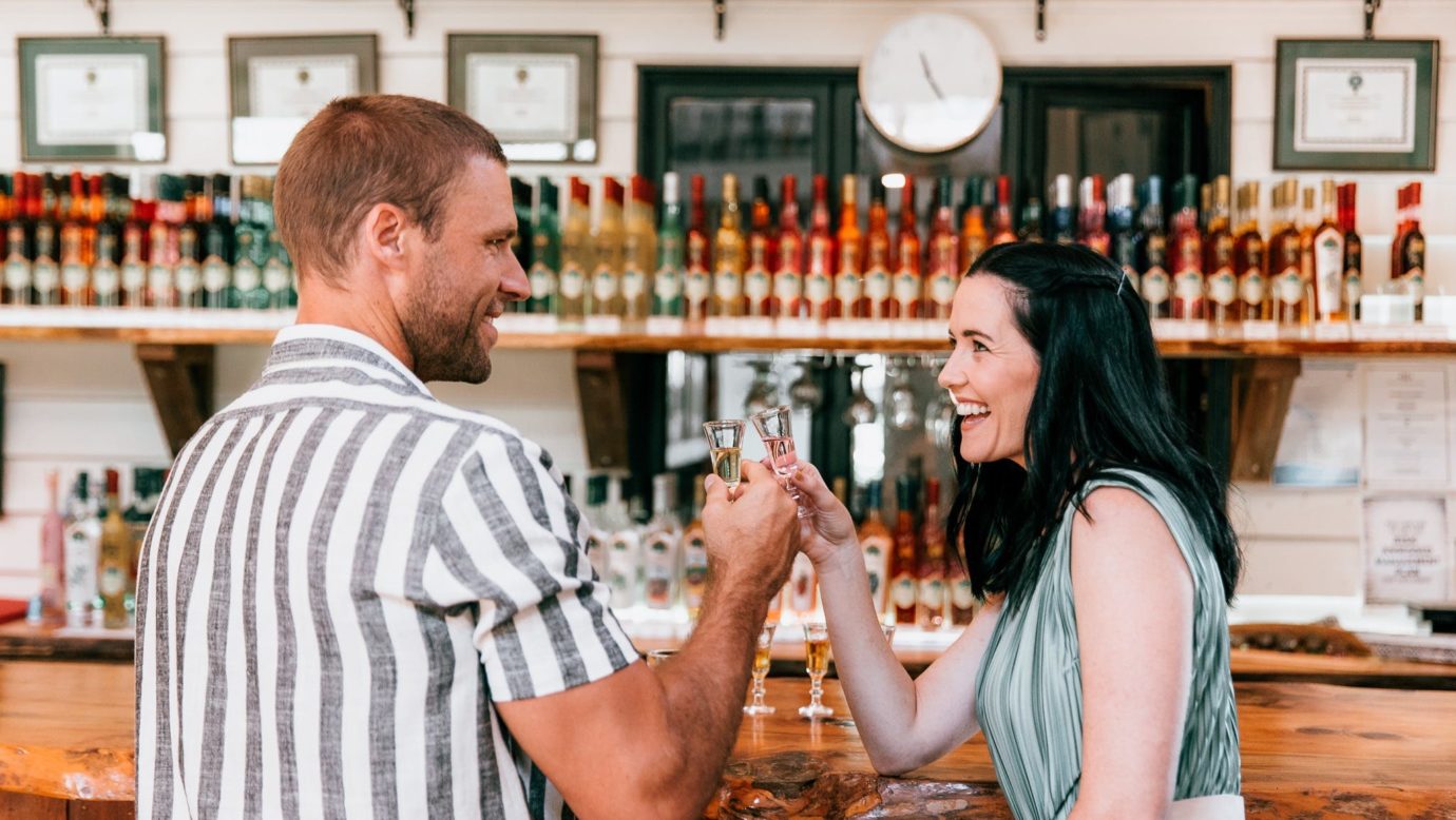 Couple tasting in front of main bar