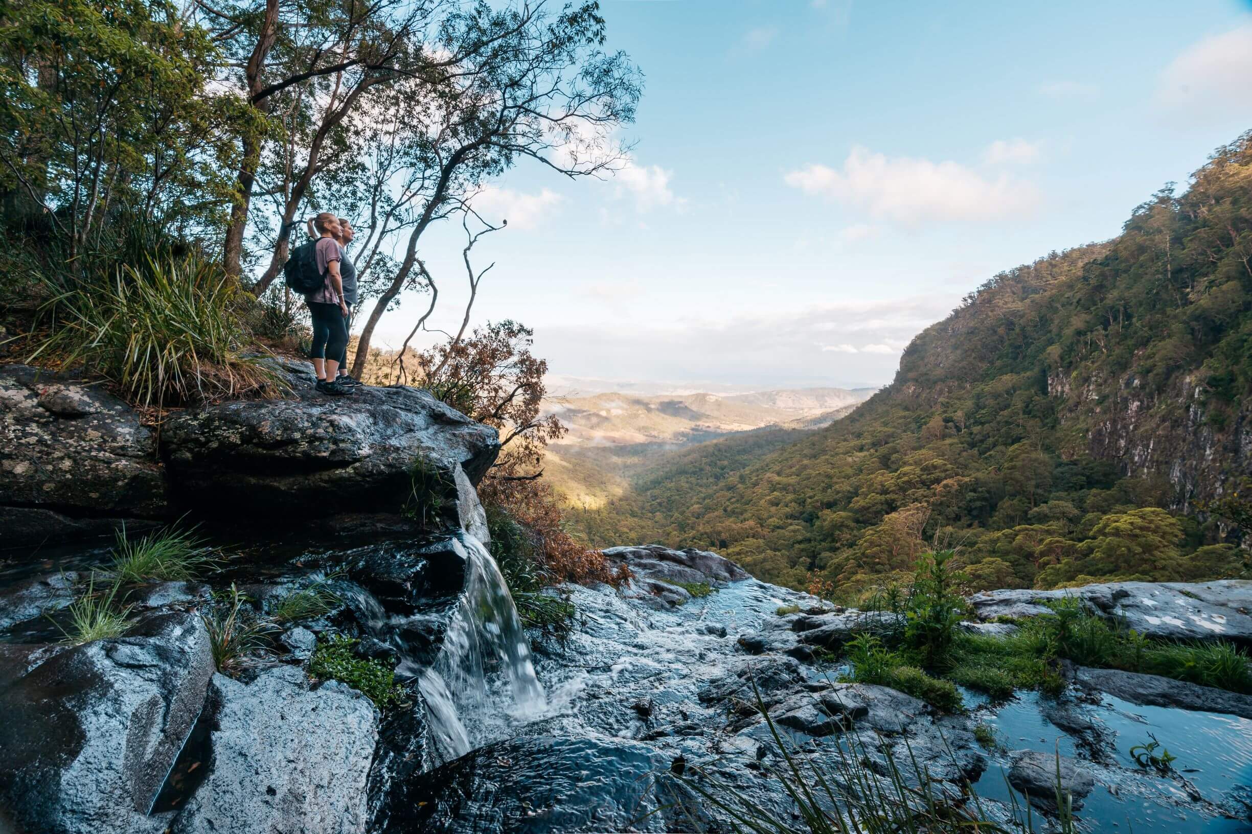 Walkers at the top of Morans Falls in Lamington National Park, Scenic Rim