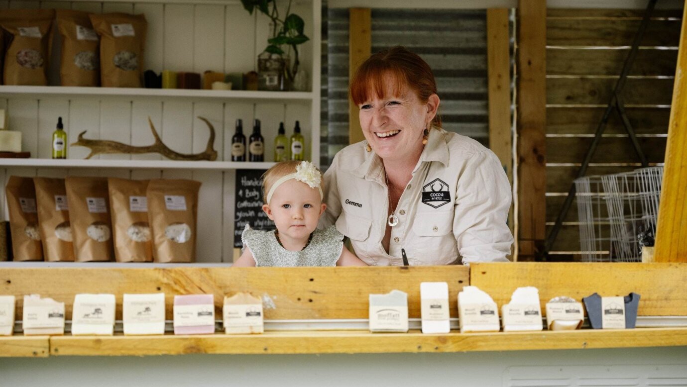 Business owner Gemma and her daughter standing in the farm gate shop surrounded by products