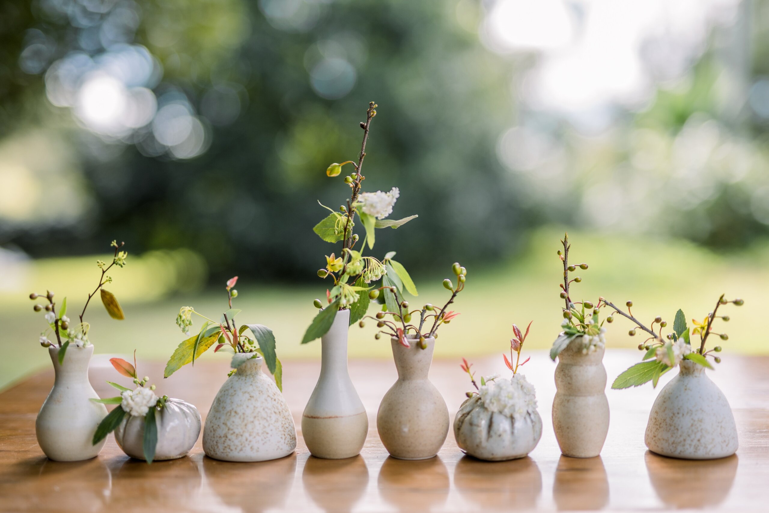 row of ceramic bud vases by Wedding Ceramics by PJ Pottery