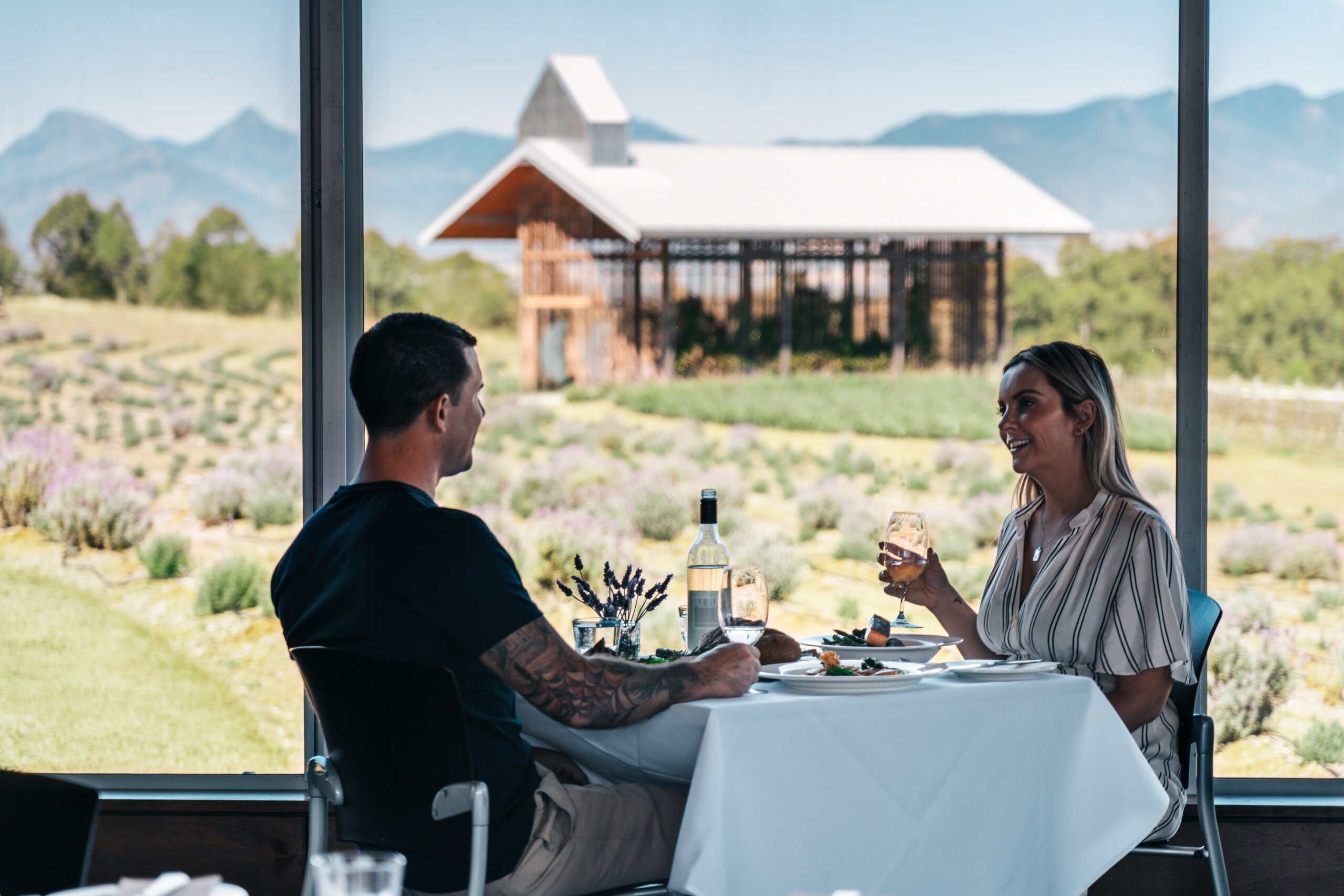 Young couple visiting Kooroomba Vineyards on the Scenic Rim Tour