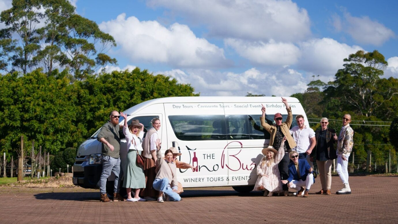 mini van with guests in front