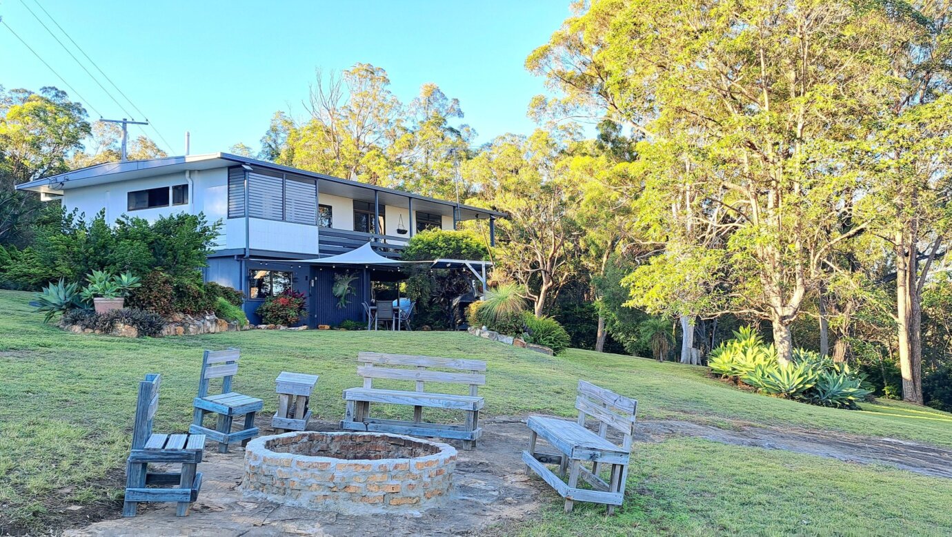 view over the garden towards Moogie House  overlooking the firepit and seating area