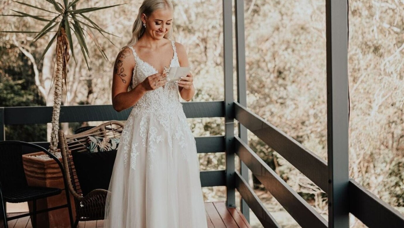 image of bride in wedding dress on the balcony at Moogie House