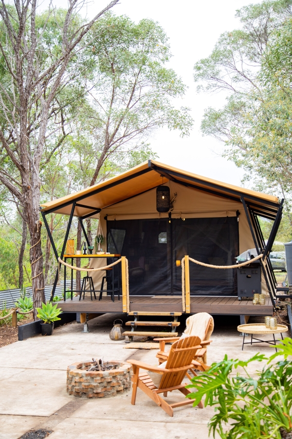 The outside of the safari tent with firepit seating