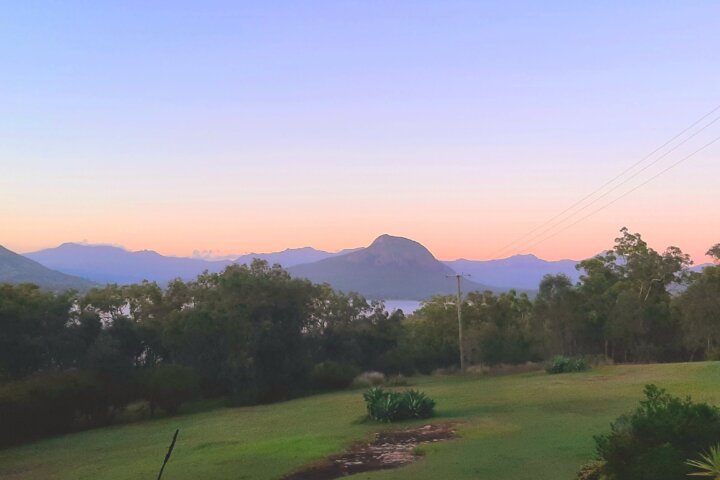 Sunset scene over the gardens at Moogie House to the Main Ranges mountains in the distance