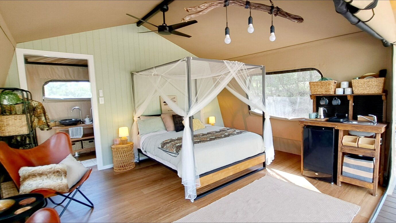 Spacious inside of safari tent complete with kitchenette.