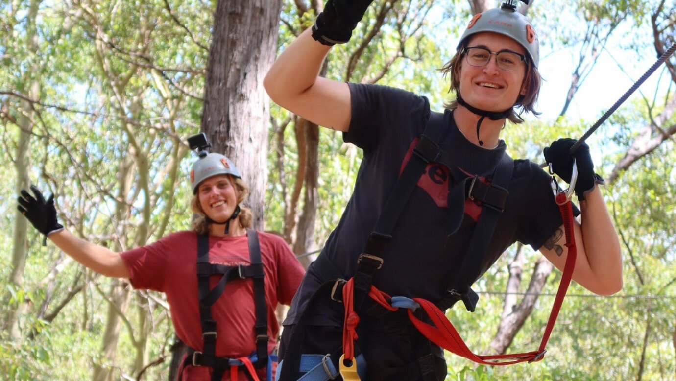 2 Guests smiling and happywhile on an obstacle