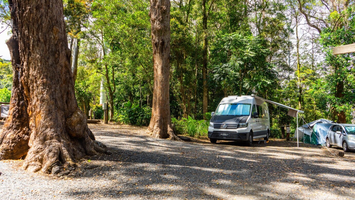 an image of a van parked on a drive on powered campsite