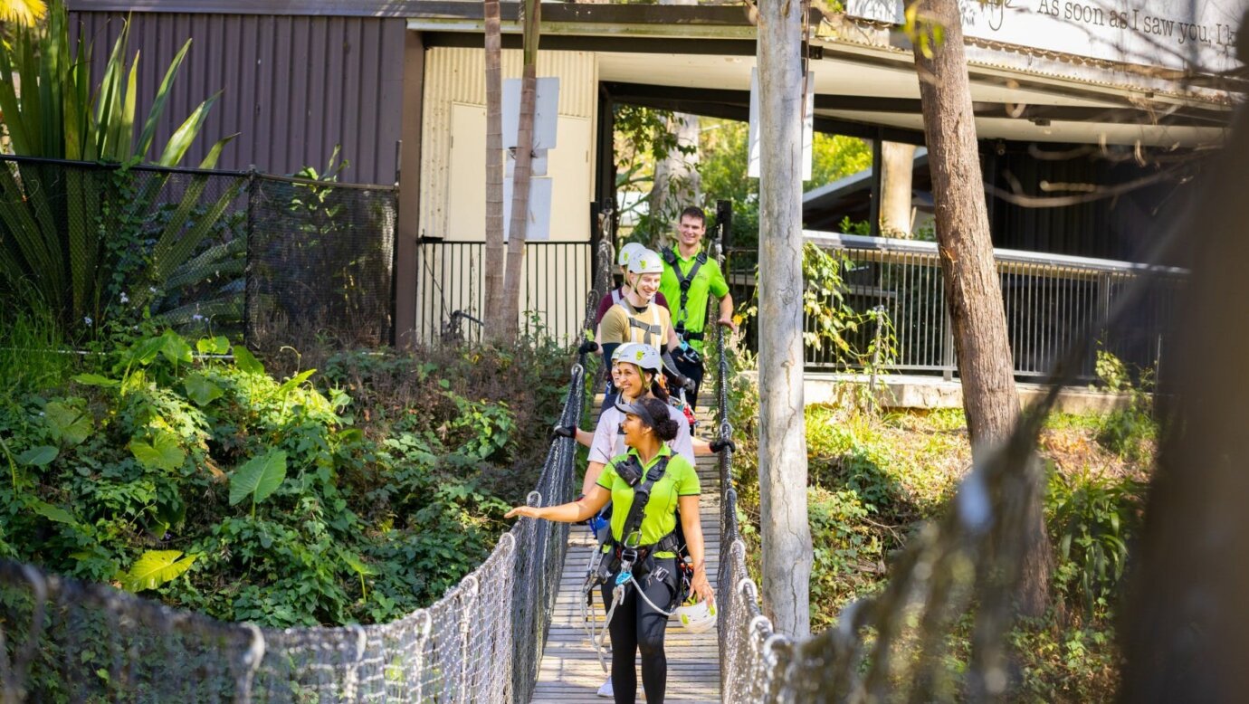 Guests being walked across bridge by guides