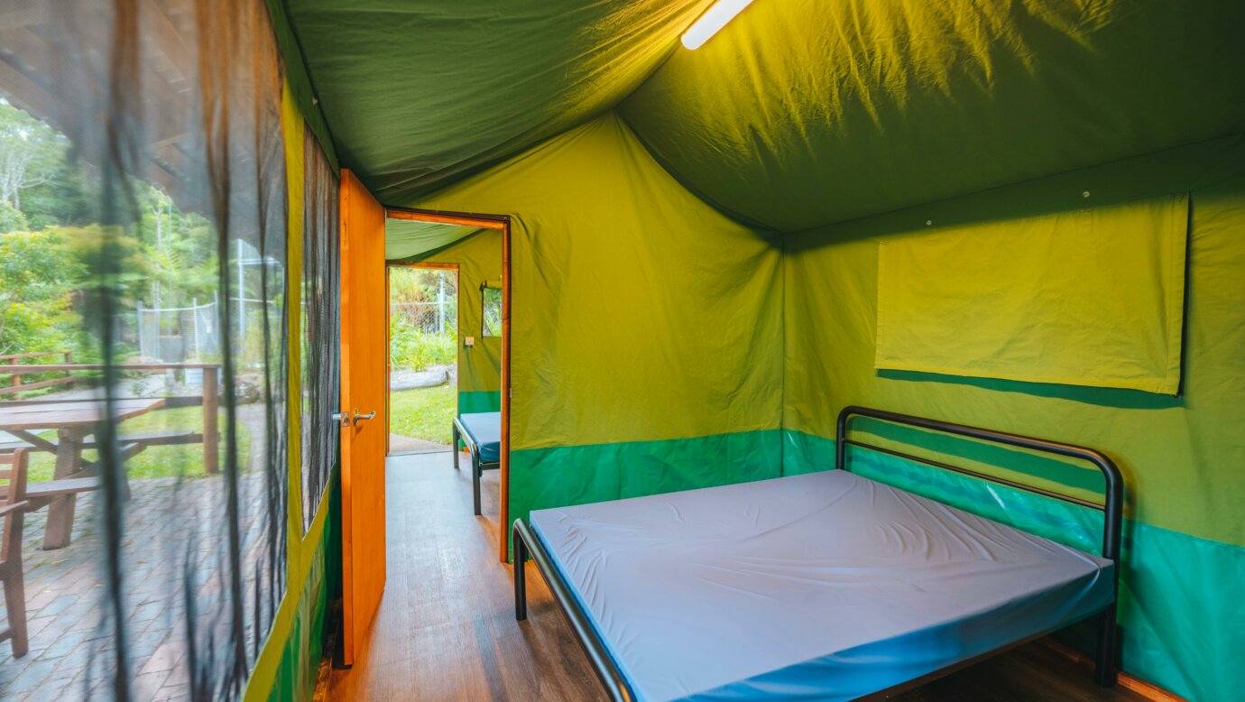 An interior image of the double bedrooms in a 'suite-style' safari tent