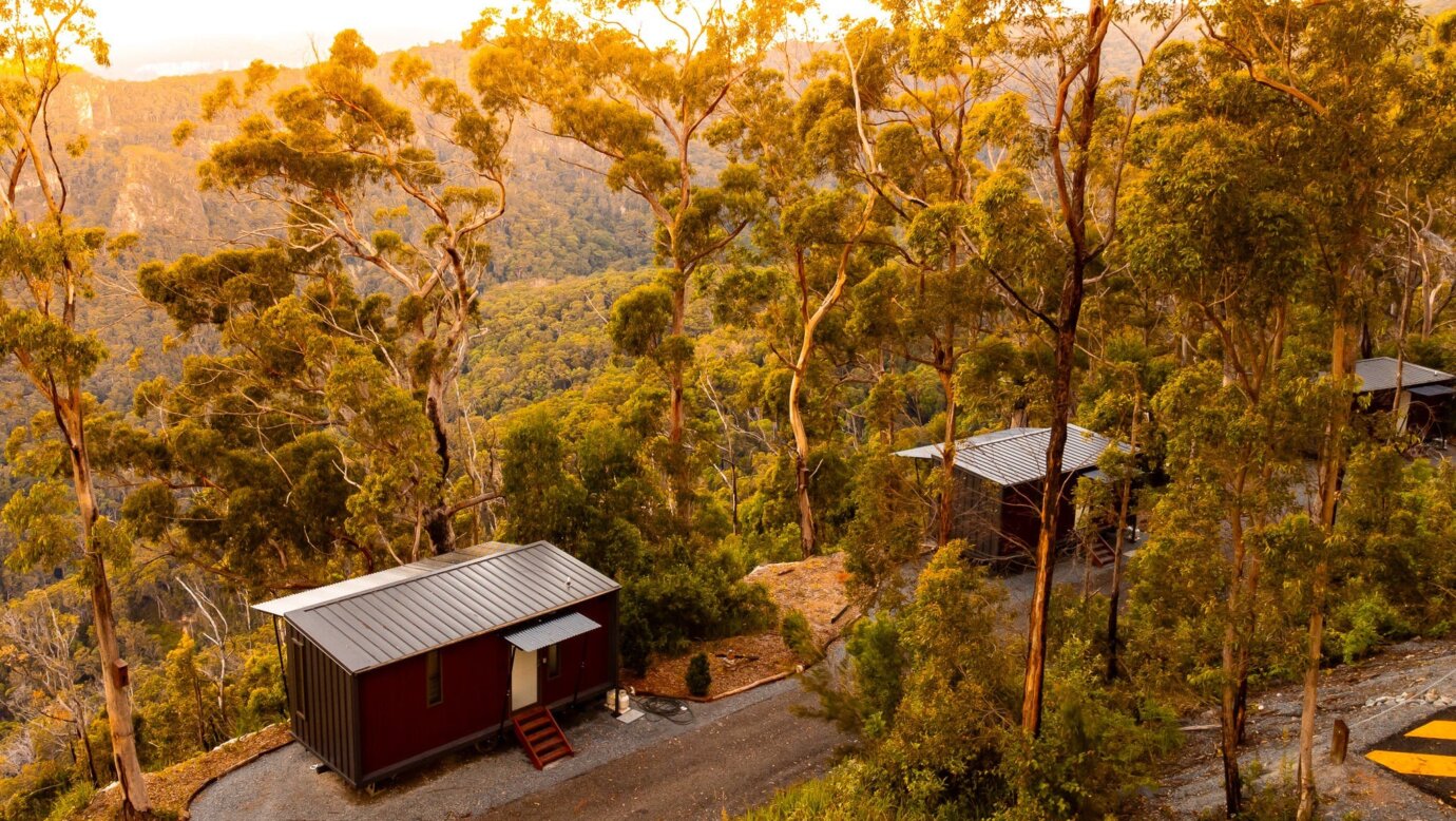 An aerial image showing the Tiny Wild Houses at Sunset