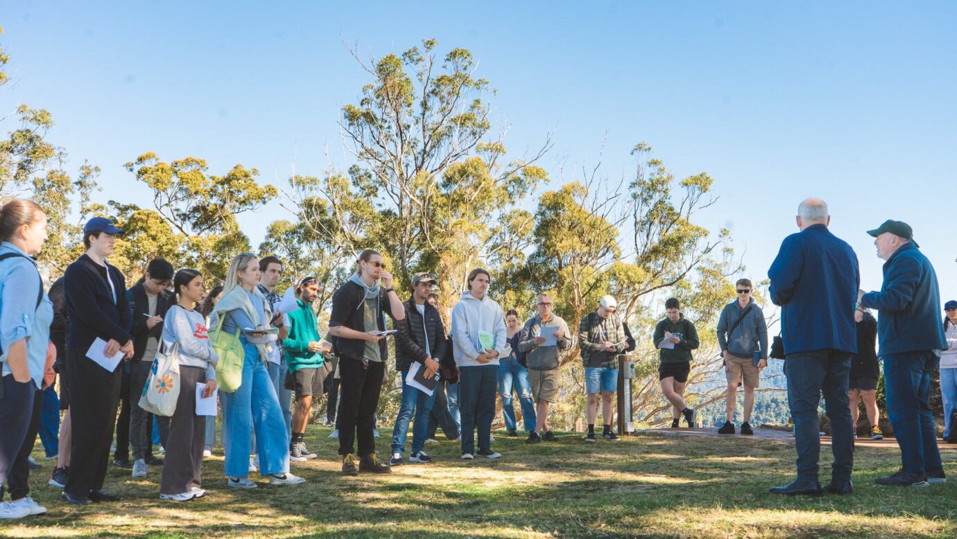 A group enjoying an educational tour activity at Binna Burra