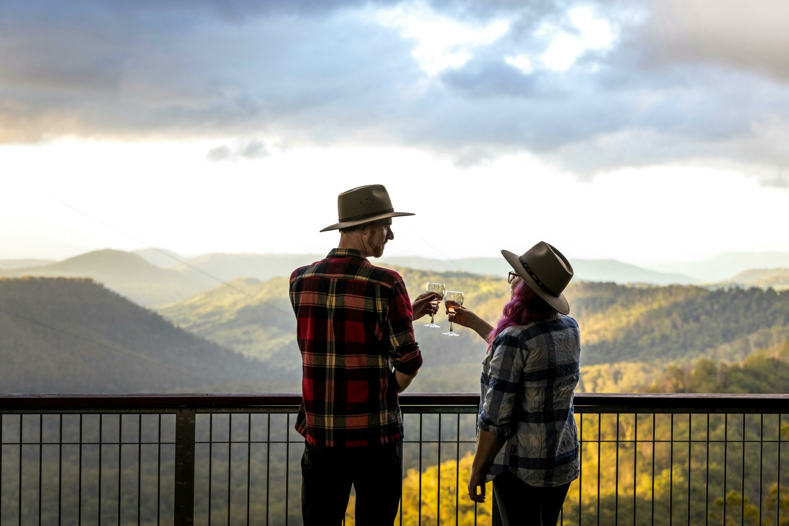couple sharing a glass of wine on the Sky Lodge veranda