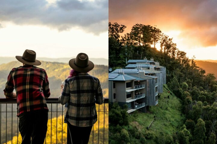 two people standing on the Sky Lodge veranda taking in the valley views and sunset hues