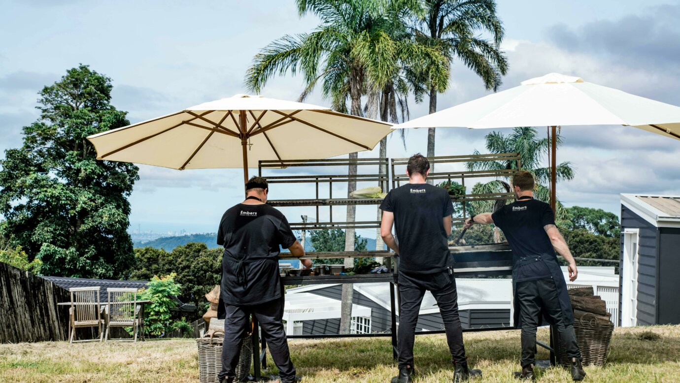 Embers Wood Fire Dining chefs overlooking the Gold Coast from a Beechmont mountain property