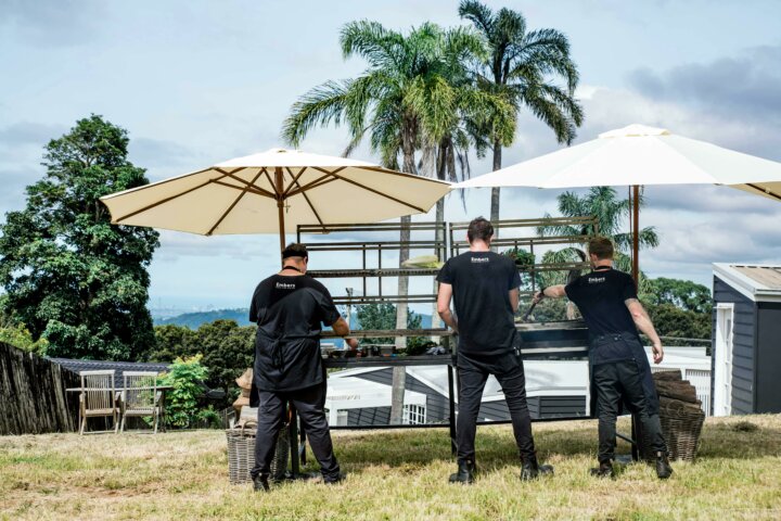 Embers Wood Fire Dining chefs overlooking the Gold Coast from a Beechmont mountain property