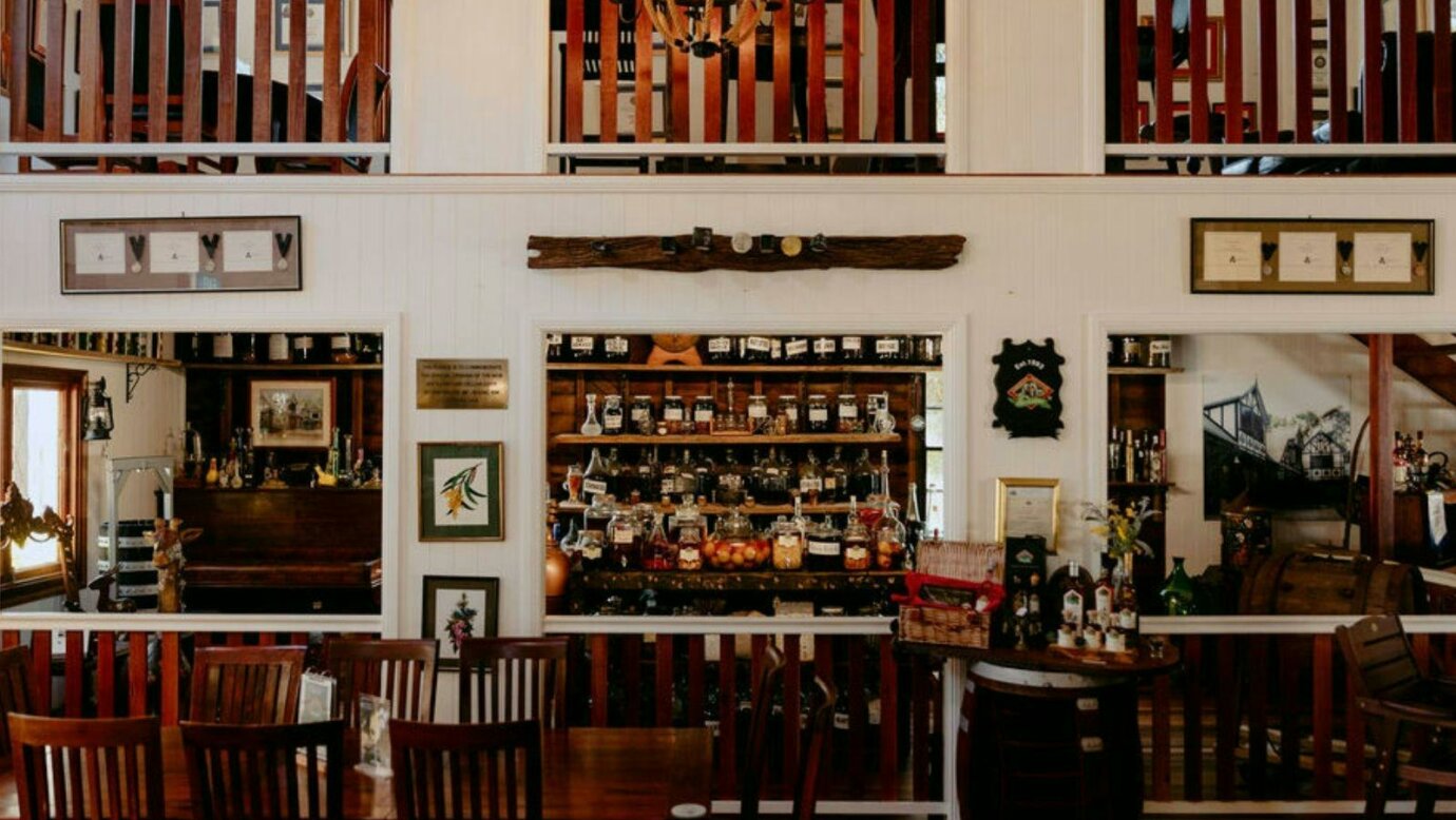 Warm timber tasting room interior at Tamborine Mountain Distillery.