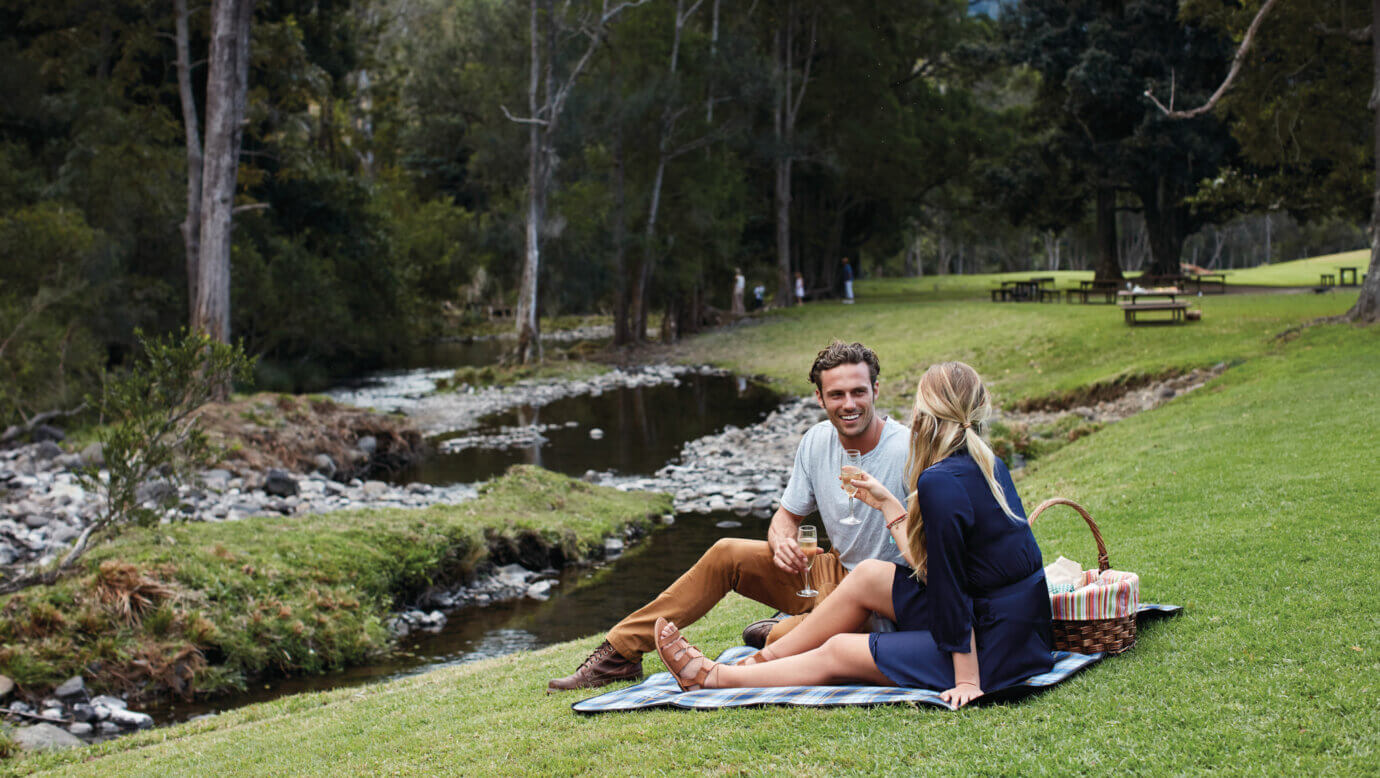 Couple on a picnic at Canungra Valley Vineyards