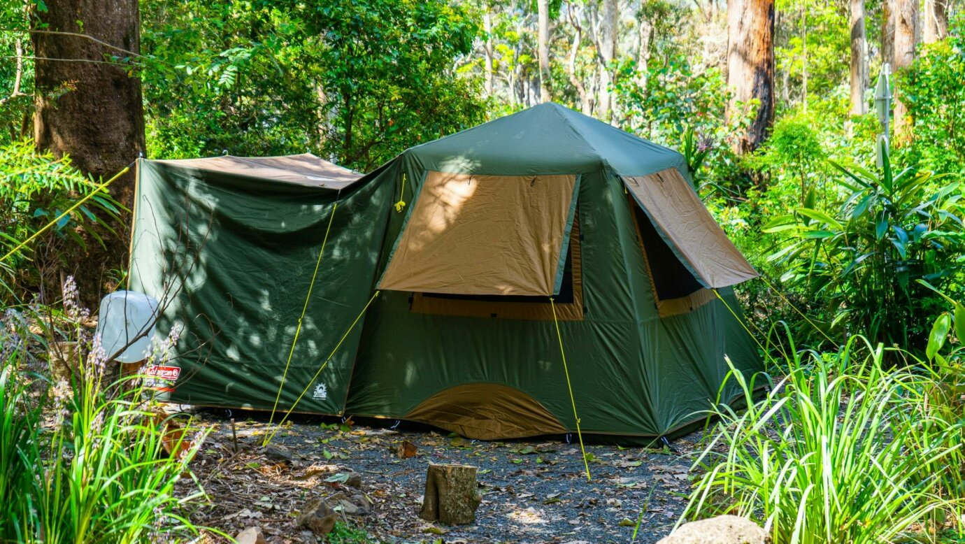 Image shows a large tent set up on a campsite