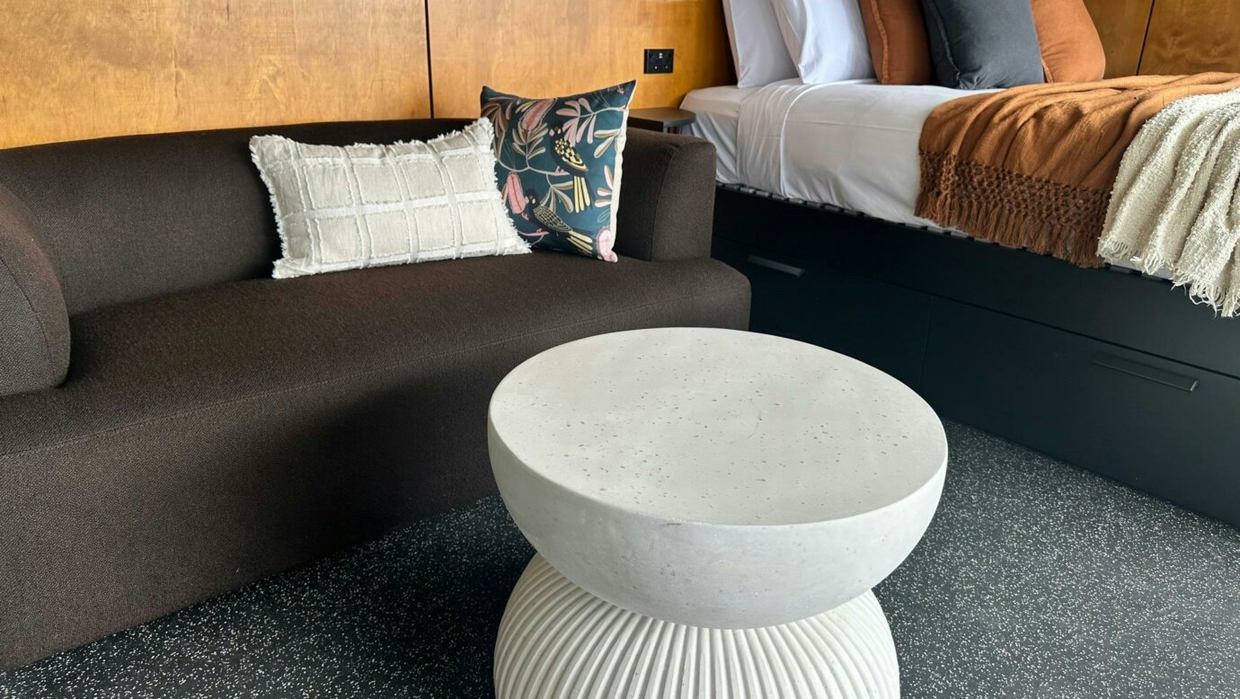Close up of Tiny Wild House lounge area and bed at Binna Burra