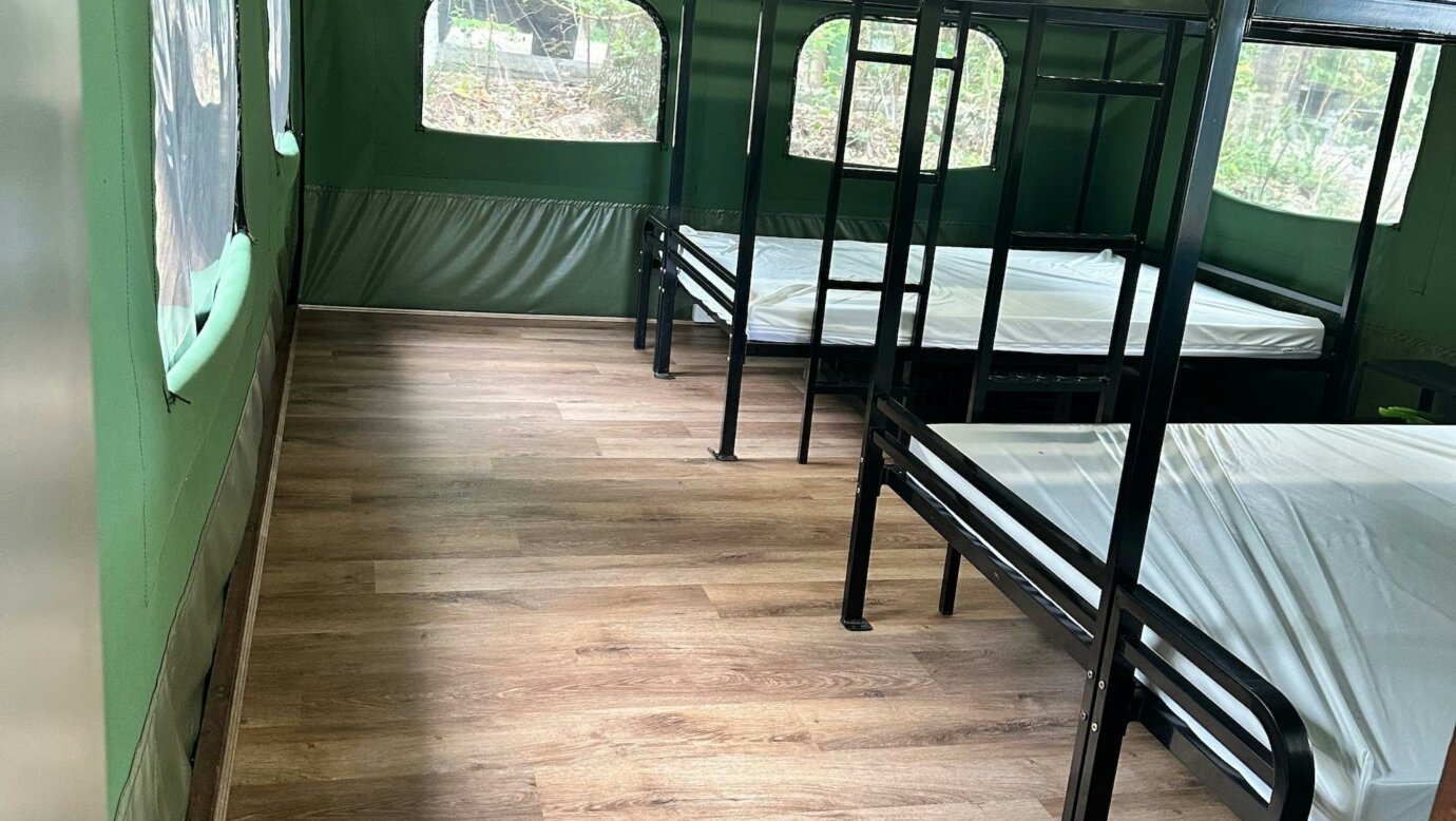 Image shows the interior of the Safari Tents with bunk beds