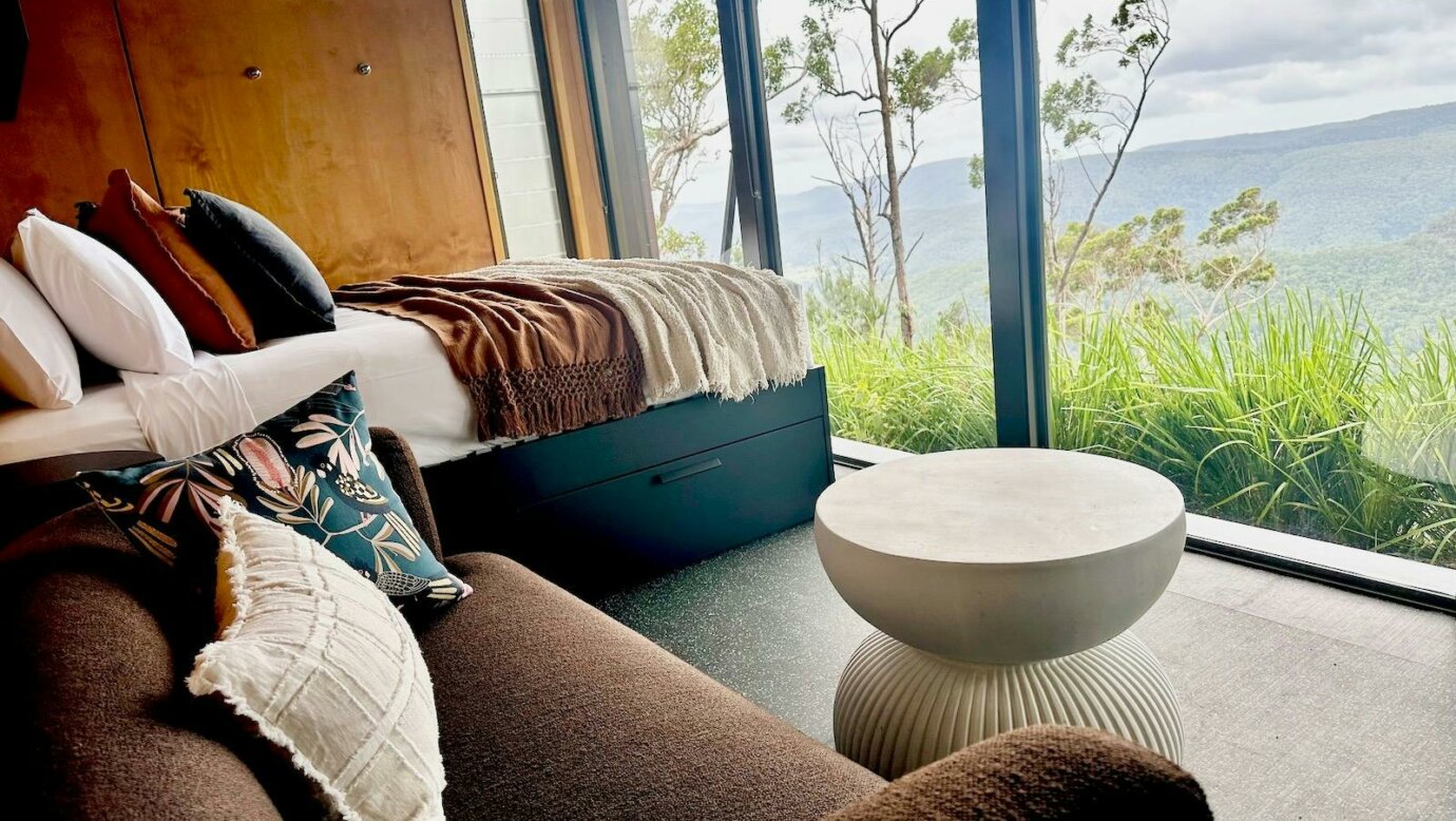 Tiny Wild House bedroom and lounge with views of the Ship Sterns Range from Binna Burra