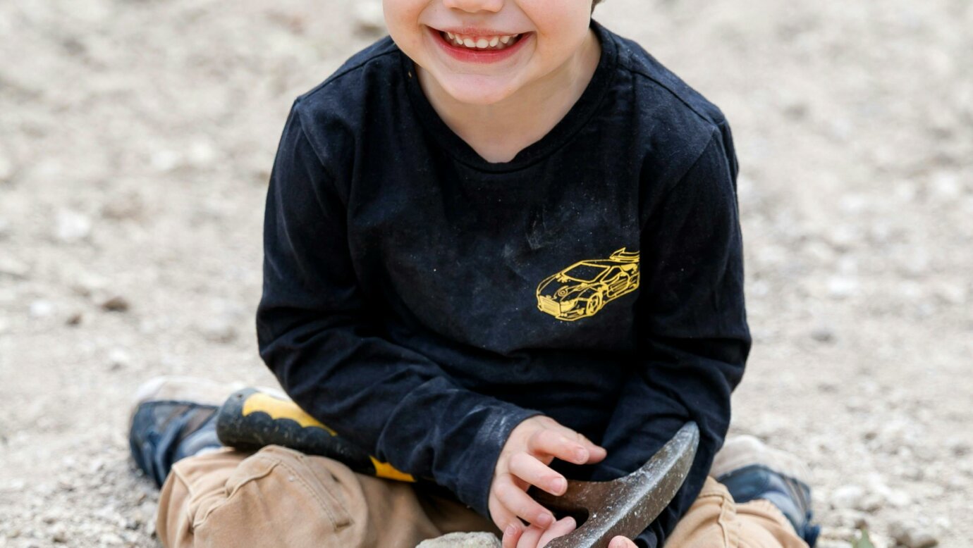 A junior fossicker with his thunderegg.