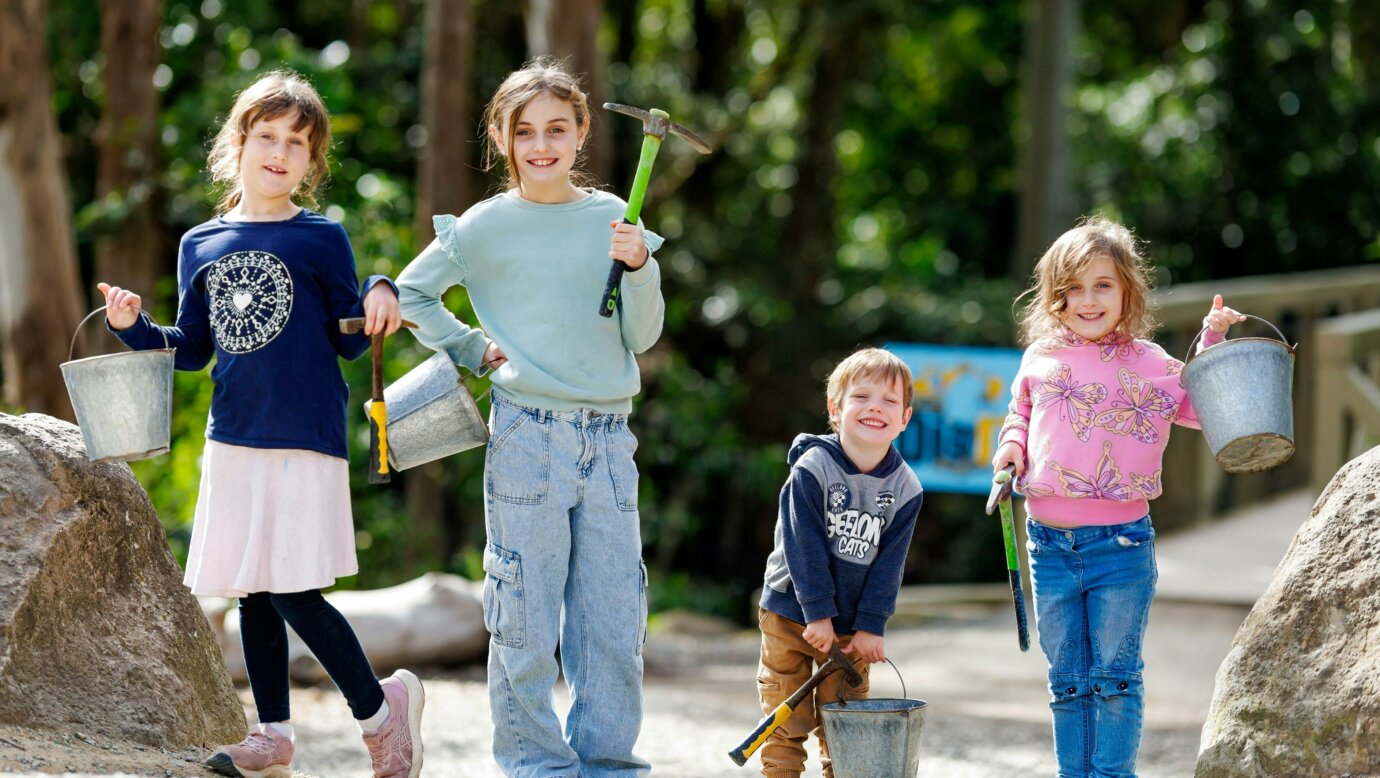 Siblings with their picks and buckets before their fossicking adventure!
